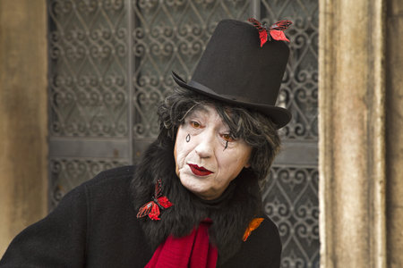 Venice, Italy - February 10, 2015: Single traditional Venetian mask on St. Mark's Square in Venice. Portrait of a man wearing a mask in Venice during the carnival days.のeditorial素材