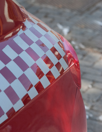 Red sports car with white and red chest decorationの写真素材