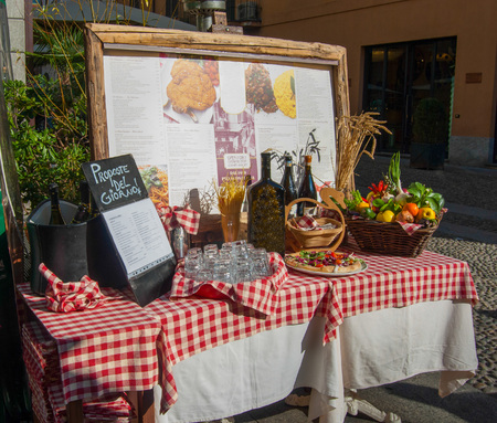 Menu with table set outside Italian restaurant - Milanのeditorial素材