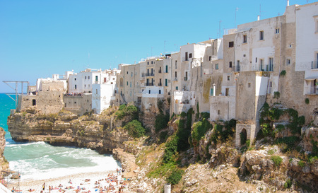 Overlooking of the typical houses of Polignano a Mare with platform for divingの写真素材