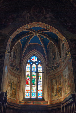 Religious colored windows and frescoes of one of the church in Gubbioのeditorial素材