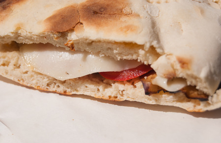 Sandwich with cheese tomatoes and aubergine in the special and characteristic breadの写真素材