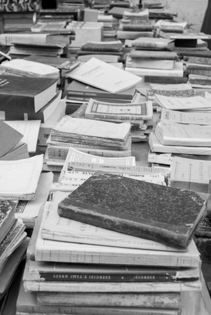 Books selling at an antique stand market along a streetの写真素材