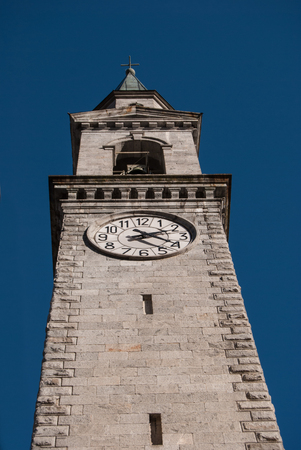 High tower of Saint Lawrence church in a little town close to Madonna di Campiglioの写真素材