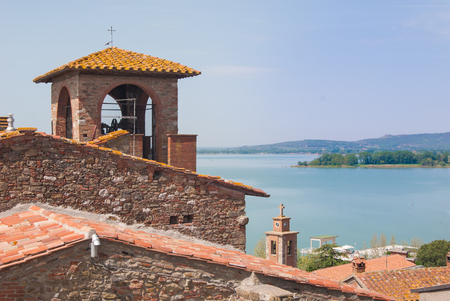 Tower of clock with panorama on Trasimeno lakeの写真素材