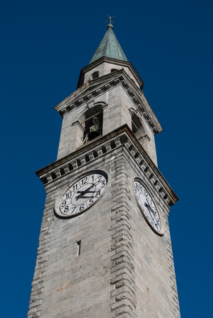High tower of Saint Lawrence church in a little town close to Madonna di Campiglioの写真素材