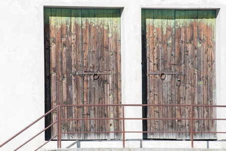 Two speculars and scraped doors with withe wallの写真素材