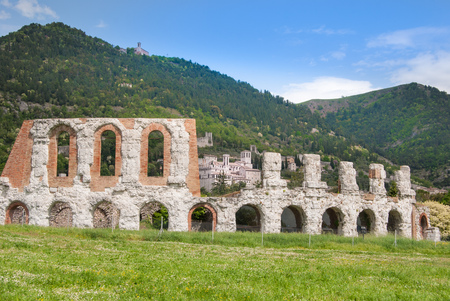 Ancient Roman theater with panorama on the Gubbio city and hillsの写真素材