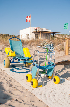 Wheelchair, crutches, walker for the disabled with first aid station in the beach of Cala Son Bouのeditorial素材