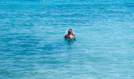 A couple hugging and kissing in the  Caribbean seaの写真素材