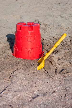 Red bucket and yellow scoop for childrenの写真素材