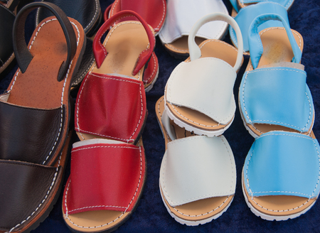 Typical Spanish shoes selling at a market along a streetの写真素材