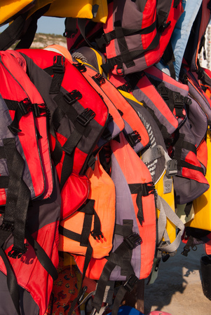Many life belts hanging on the beachの写真素材