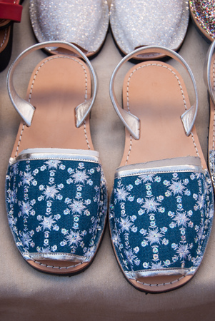 Pair of Spanish shoes selling at a market along a streetの写真素材