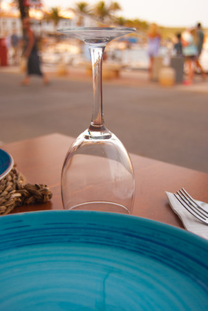 Close-up of flute and light blue ceramic plate on the table in the open airの写真素材