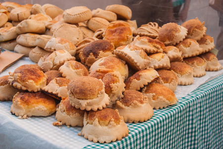 Many Flaons with cheese and Formatjades with meat at the weekly marketの写真素材