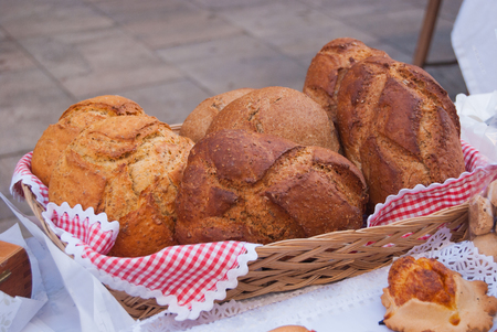 Different type of typical bread and cheese Flaons exposed on a tableの写真素材