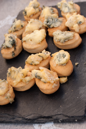 Finger foods for tasting blue cheese at a street marketの写真素材