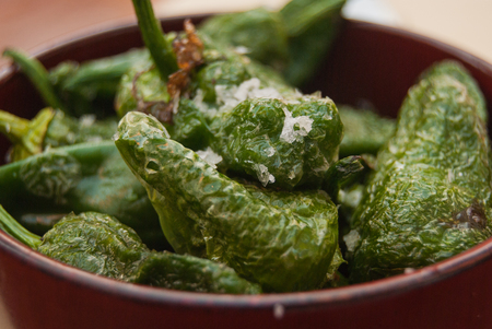 Close-up of many sweet pepper into a ceramic brown cupの写真素材