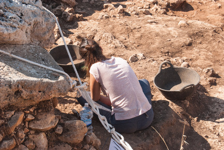 Professional archaeologist is digging in search of historical finds in Spainの写真素材