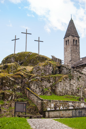 Church with frescoes of the macabre dance on the top of a promontory close to Madonna di Campiglio in the Dolomitesの写真素材