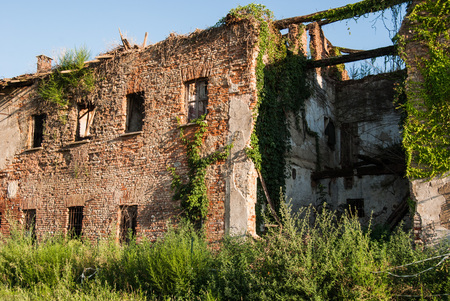 Old farm unsafe without roof and partially destroiyedの写真素材