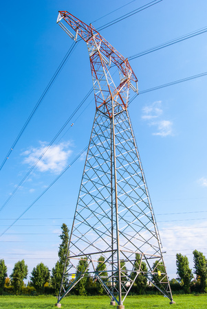 Red and white metal electric trellis from the groundの写真素材
