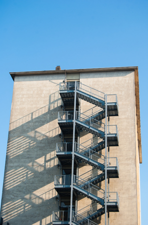 Five-storey of metal safety stairs outside the buildingの写真素材