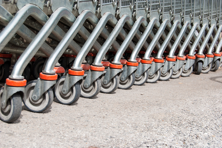 Carriage wheels one behind the other off a shopping mallの写真素材