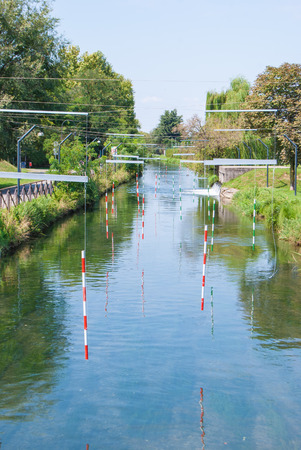 Many bollards suspended for kayaks who train on the riverの写真素材