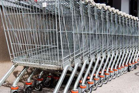 Many carts one behind the other outside a mallの写真素材