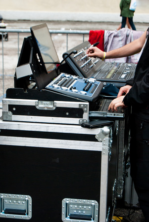 Hands of technicians during the sound check before the concertの写真素材