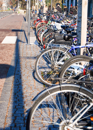 Bike parking crowded outside in the streetの写真素材
