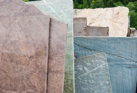 Raw and overlapping Carrara marble slabs outsideの写真素材