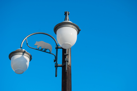 Bear outline on a typical streetlight in Madonna di Campiglioの写真素材