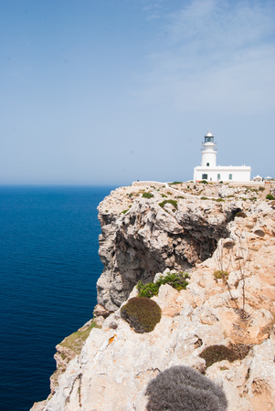 White lighthouse on the reef The north of the north in spanish called El nord del nordの写真素材