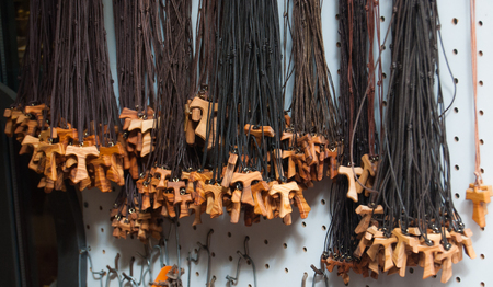 Necklace with wooden cross exposed outside of a gifts shopsの写真素材