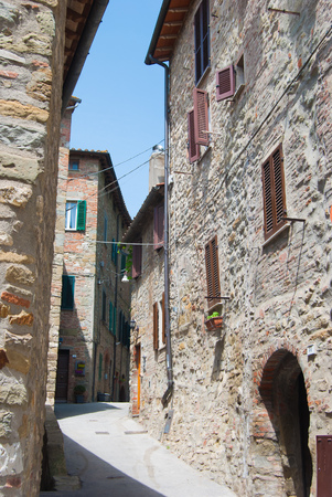 Features old houses with stone walls of a city on Lake Trasimenoの写真素材