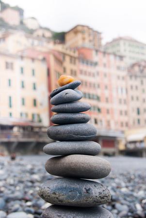 Grey stones in equilibrium on the beach of Camogliの写真素材