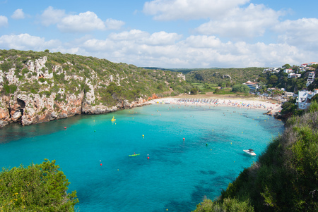 The rocky promontory and the crystalline sea of one of the coves of the minor island of the Balearics in Spainの写真素材