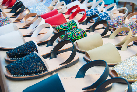 Typical Spanish shoes selling at a market along a streetの写真素材