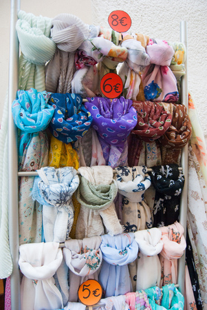 Scarves made in Italy exposed outside of a gifts shopsの写真素材