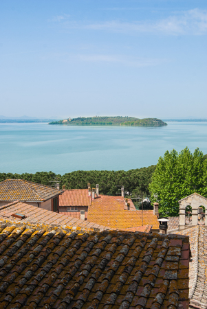 Panorama on Trasimeno lake with little island in the middleの写真素材