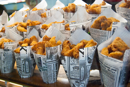 Anti-grease cone-shaped containers with fried chickenの写真素材