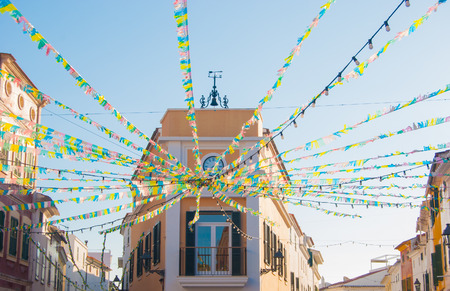 A lot of little and colorful flags arranged in a radial pattern of a little town of Menorcaの写真素材