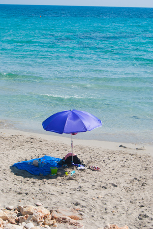 Marine equipment and clothing of a family on the shoreline of spanish islandの写真素材