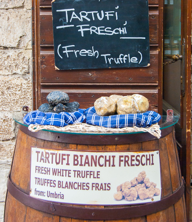 Barrel with fake truffles outside a shopの写真素材