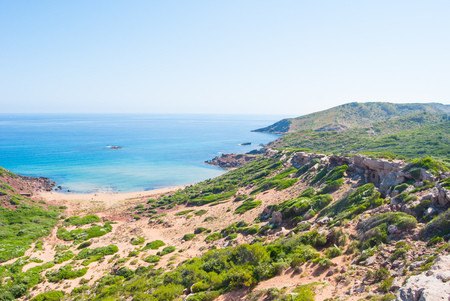 Rocky promontory and crystalline sea of one of the bays of the minor island of the Balearics in Spainの写真素材