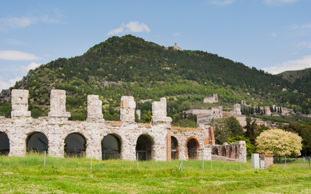 Ancient Roman theater with panorama on the Gubbio city and hillsの写真素材