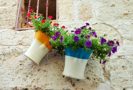 Hand made and colored Italian vases hanging from a souvenir shopの写真素材